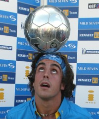 Fernando Alonso takes British Pole